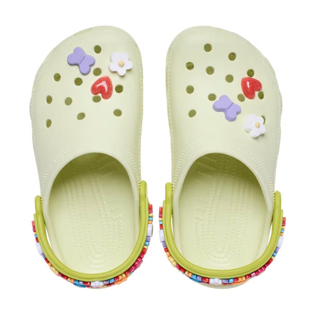 Top down view Pair of light green kids Crocs clogs with colorful freindships decorations on a white background.,
198445157776,
198445157783,
198445157790,
198445157806,
198445157813,
198445157820,
198445157837,, 198445157776, 198445157783, 198445157790, 1