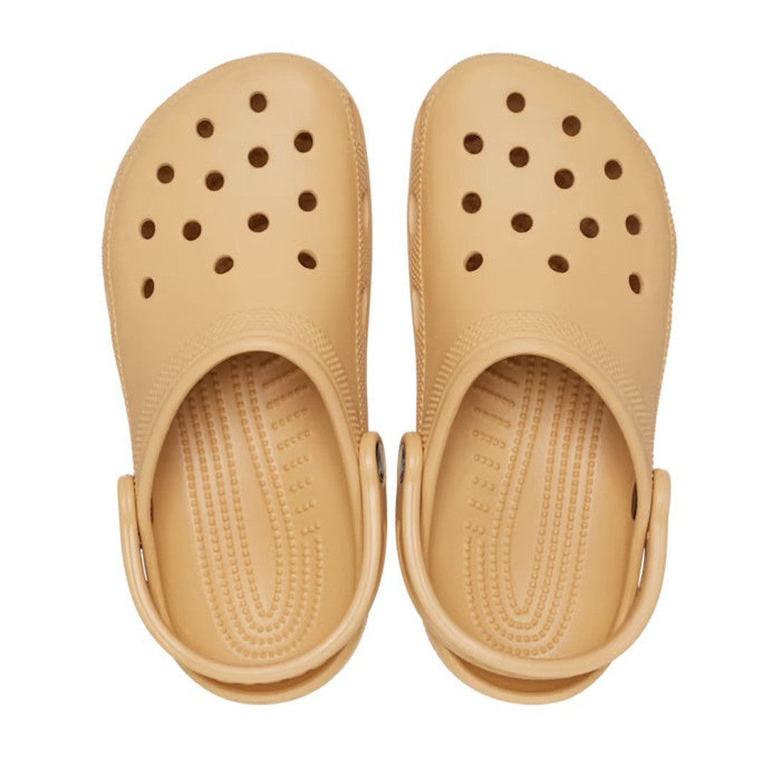 The Crocs - Classic Clog Wheat Tan Adults features a tan unisex design with ventilation holes and textured footbeds for lightweight comfort, shown top-down on a white background—ideal for classic Croc enthusiasts., 196265698592, 196265698608, 196265698615