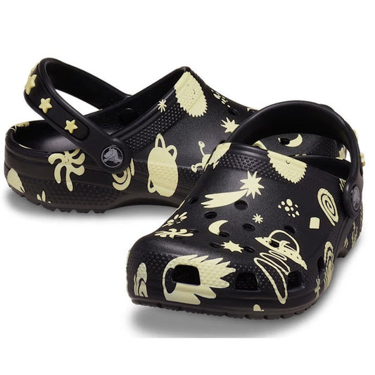 Crocs Kids Youths Classic Glow Space Clog in black—fun glow-in-the-dark stars, secure heel strap, cushioned sole for happy feet.  ksnz
