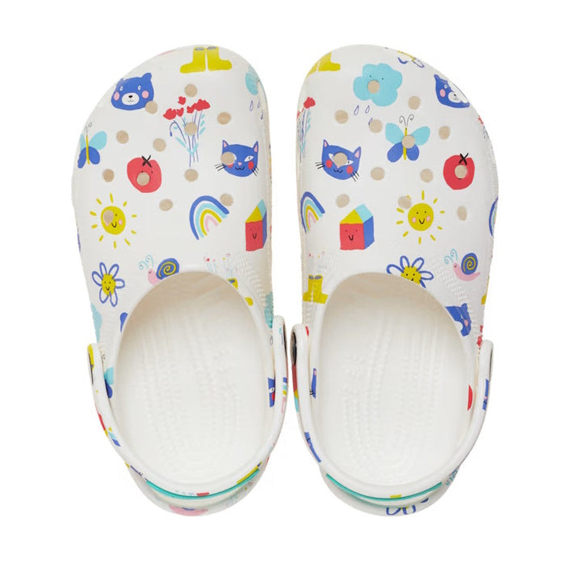 The Crocs Kids - Youths Classic Clog K Doodle Print White Multi Sandal features colorful cartoon designs—suns, flowers, cats, butterflies, rainbows, and houses—making them perfect back-to-school shoes., 196265775811, 196265775828, 196265775835, 1962657758