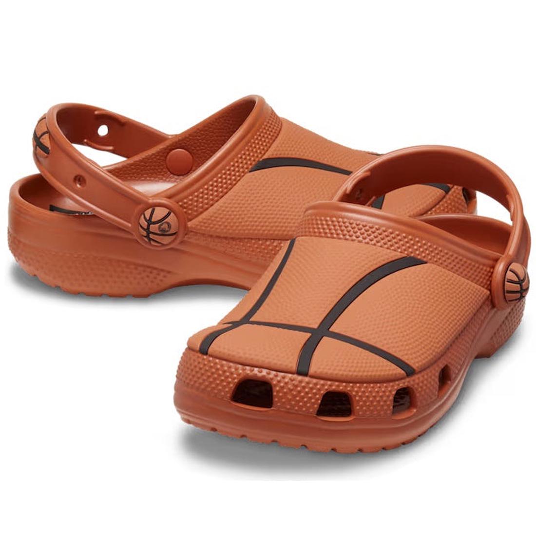 The Crocs Kids - Youths BasketBall Classic Clog K Brown Sandals feature cozy slip-on clogs, sporty black lines, and a fun hoop detail.  ksnz
