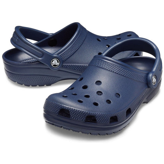 The Crocs - Classic Clog Navy Adults womens & mens features ventilation holes, textured soles, and adjustable heel straps for unisex style and all-day comfort, displayed on a white background.