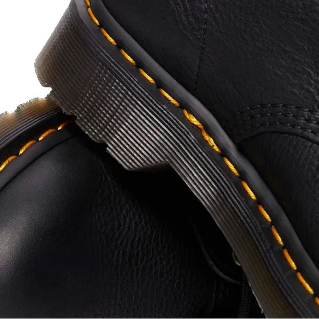 Close-up of Dr Martens 101 UB Black Ambassador 6 Eye Leather Boot, highlighting the thick sole, distinct yellow stitching, and textured black Ambassador leather. The focus is on the soft leather and signature stitching details., 190665693683, 190665693690