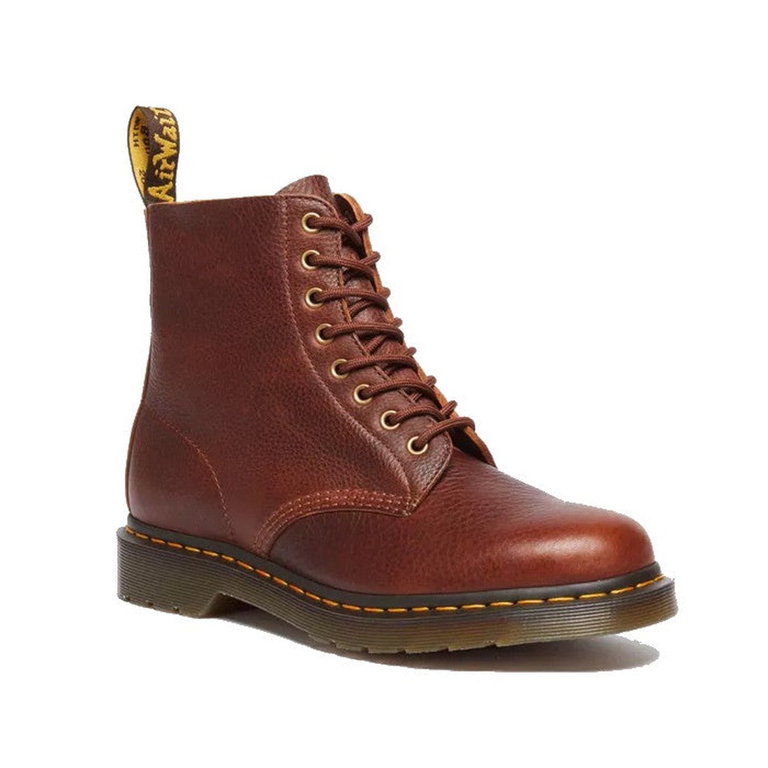 Image of right foot, side on of Dr Martens 1460 Pascal Cashew Tan Ambassador showing cut edhe at top of boot, pull tab and brass looking eyelets with classic yellow stitching-Foot Forward Shoes