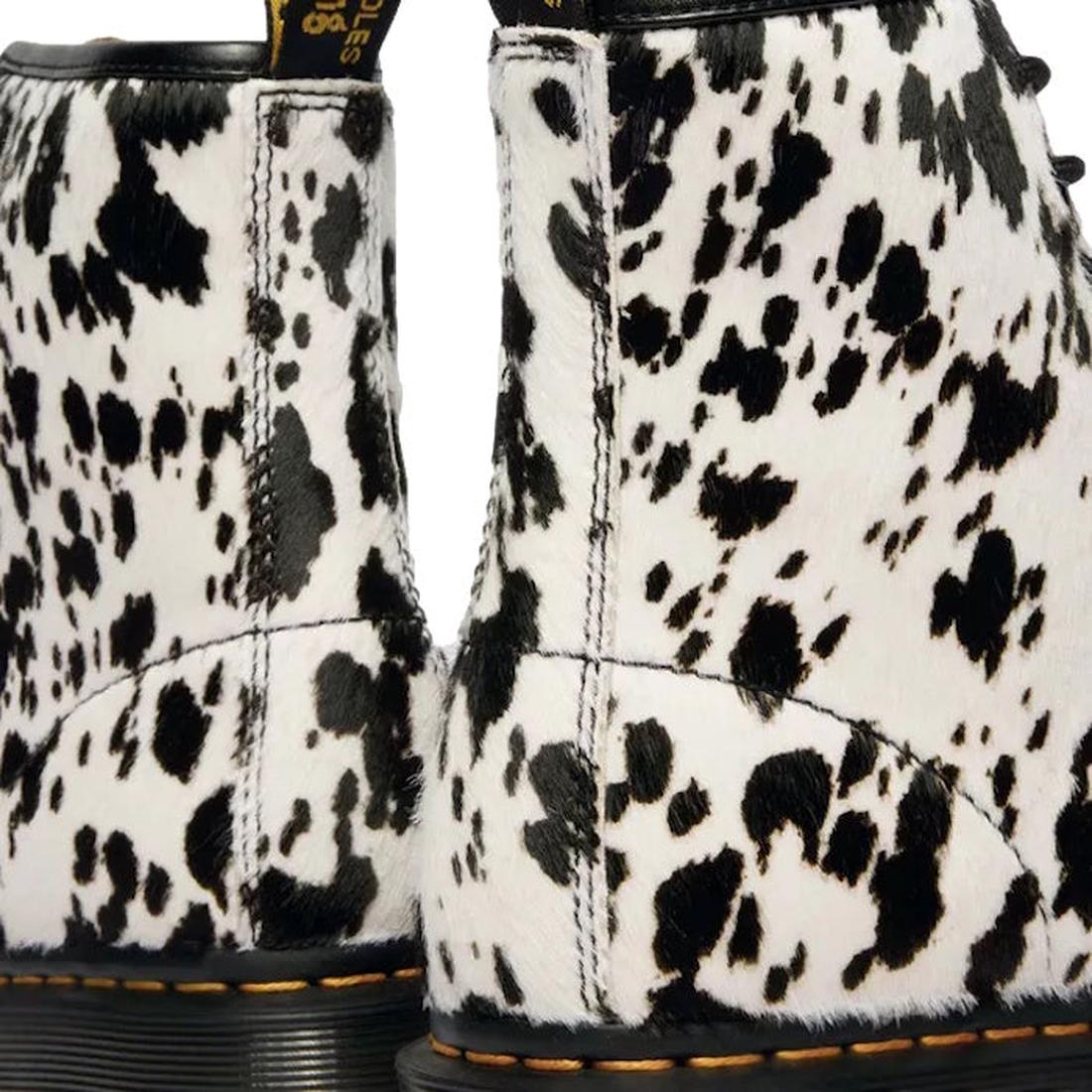 Close-up of the Dr Martens 1460 Bex Dalmatian Hair On Leather Lace Up Boot, showcasing its black and white Dalmatian print, yellow stitching, and textured Hair-On leather on the back., 190665780307, 190665780314, 190665780321, 190665780345, 190665780352, 