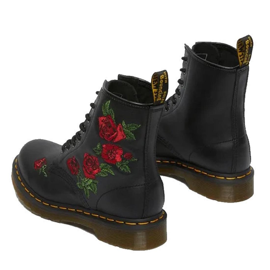 The Dr Martens 1460 Vonda Red Roses Softy T Leather Boot is a black boot with yellow stitching, red embroidered roses on the sides, signature AirWair Bouncing Soles, and yellow logo tags at the back., 190665206036, 190665206043, 190665206050, 190665206074