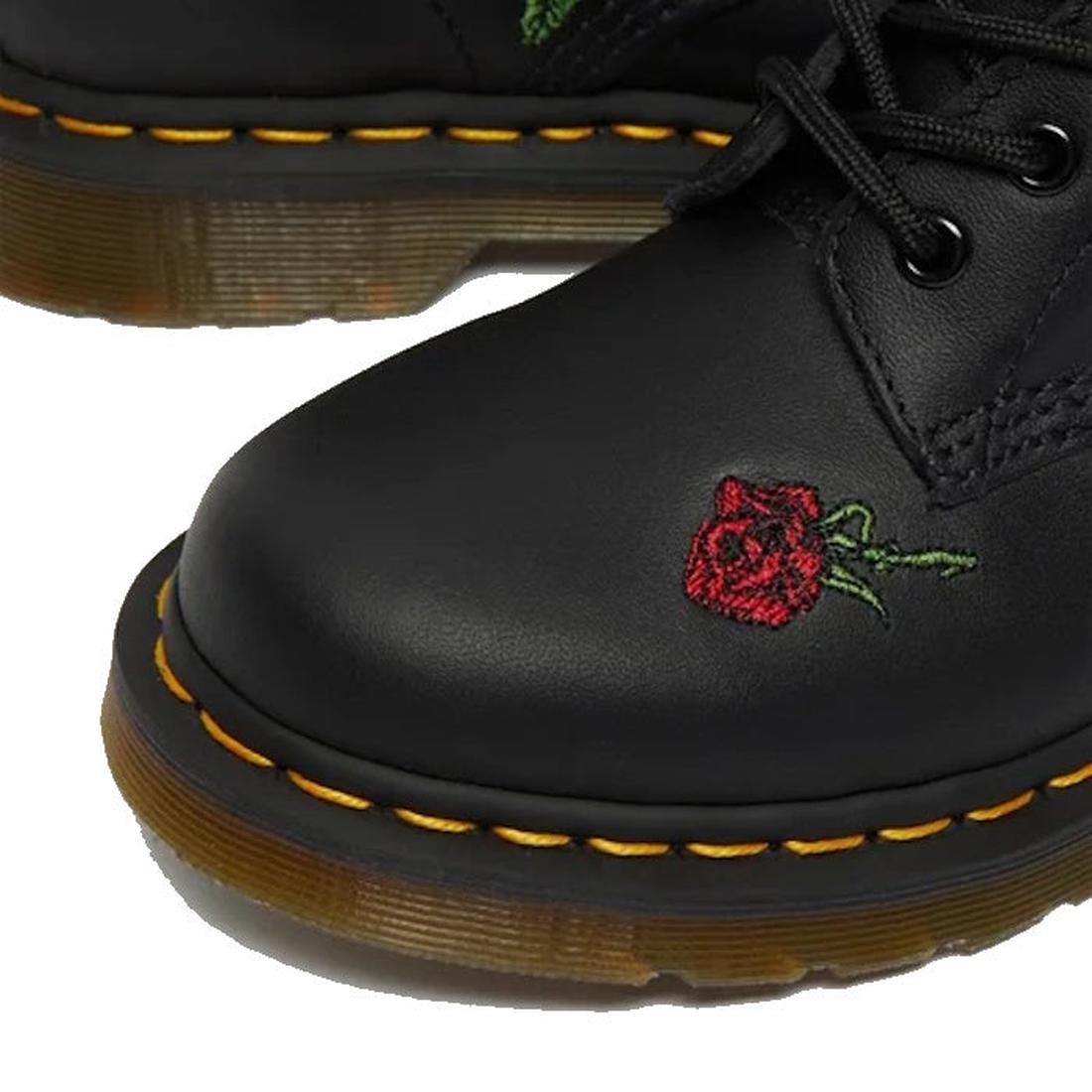 Close-up of Dr. Martens 1460 Vonda Red Roses Softy T Leather Boot, showing yellow stitching, AirWair Bouncing Soles, and a small red rose with green stem embroidered on the toe., 190665206036, 190665206043, 190665206050, 190665206074, 190665206081, 190665