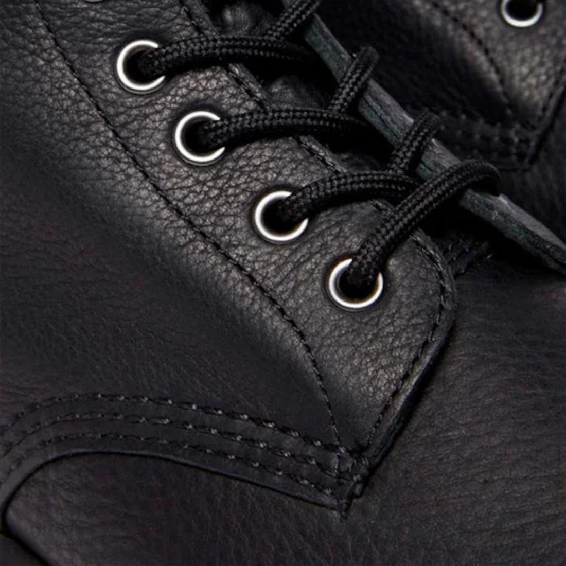 Close-up of a Dr Martens 1460 Pascal Ambassador Black Leather boot, featuring visible stitching, metal eyelets, black laces, and Goodyear-welted construction with textured leather craftsmanship., 46779, 190665663136, 190665663143, 190665663150, 1906656631
