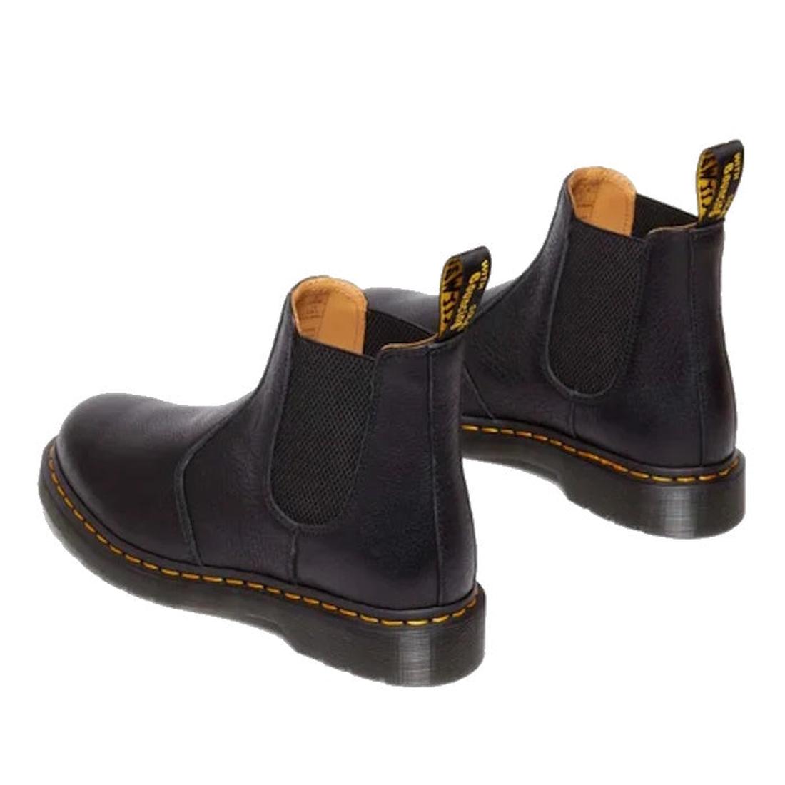 The Dr Martens 2976 Ambassador Black Leather Chelsea Boot features durable black Ambassador leather, yellow stitching, elastic side panels, Goodyear-welted soles, and pull tabs at the back, shown on a white background., 50056, 50057, 50059, 190665663303, 