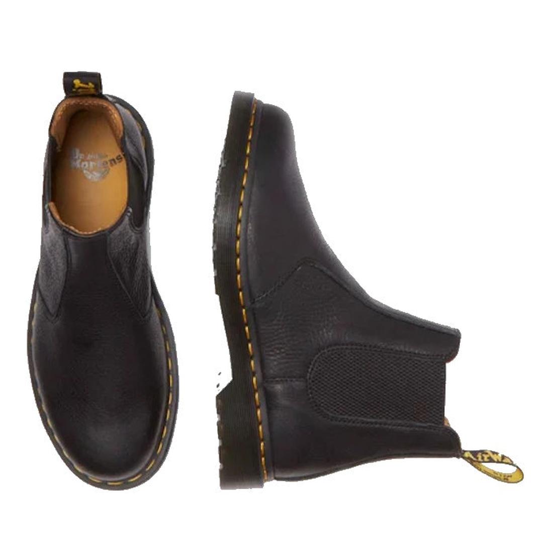 The Dr Martens 2976 Ambassador Black Leather Chelsea Boot, featuring Goodyear-welted construction, yellow stitching, and heel loops, is shown in side and top views on a white background., 50056, 50057, 50059, 190665663303, 190665663310, 190665663327, 5006
