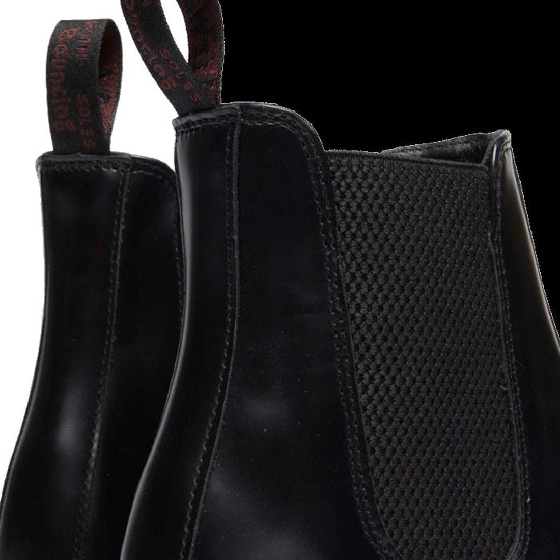 Close-up of Dr Martens Flora elastic gusset black leather ankle boots with textured side panel on a white background.,
190665698183,
190665698190,
190665698206,
190665698220,
190665698237,
190665698244,, 190665698183, 190665698190, 190665698206, 190665698