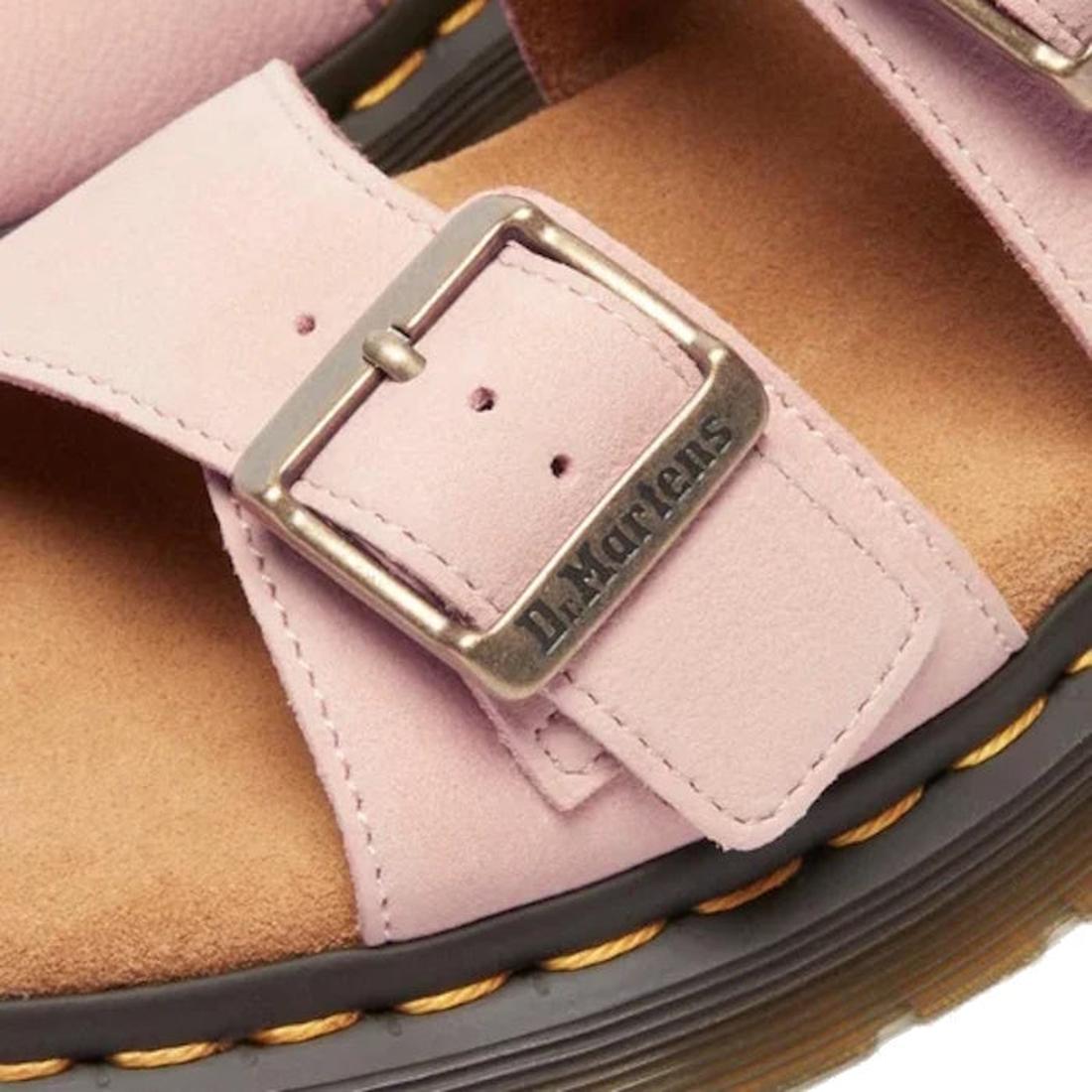 Close-up of a pink sandal with a buckle and brown insole, featuring the Dr. Martens logo. Dr Martens Josef Slide.,
190665707533,
190665707540,
190665707557,
190665707571,
190665707588,, 190665707533, 190665707540, 190665707557, 190665707571, 190665707588,