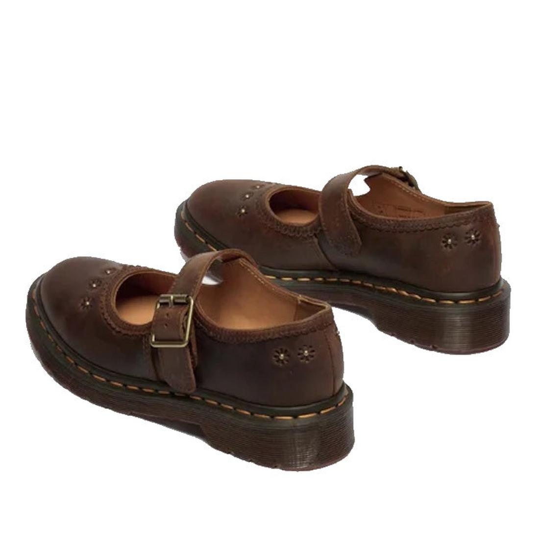 The Dr Martens Mary Jane Flower Dark Brown Crazy Horse shoes feature buckled straps, decorative perforations, and thick rubber soles with signature yellow stitching, crafted from Crazy Horse leather., 52079, 190665785531, 190665785548, 190665785555, 19066