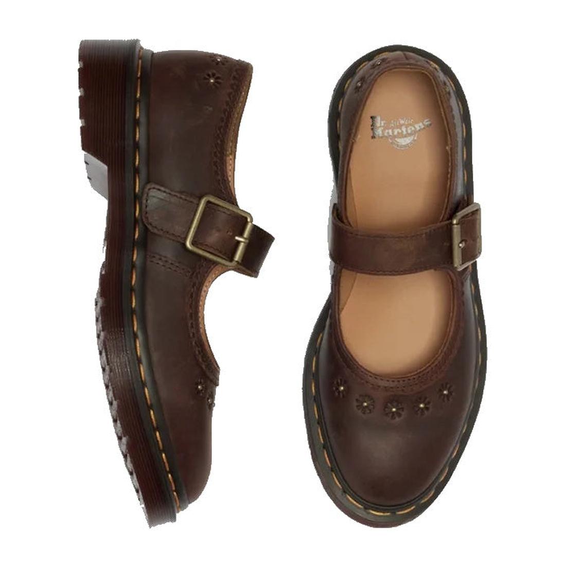The Dr. Martens Mary Jane Flower Dark Brown Crazy Horse shoes feature a buckle strap, floral cutouts, chunky soles, and signature yellow stitching, shown from the side and top views., 52079, 190665785531, 190665785548, 190665785555, 190665785579, 19066578