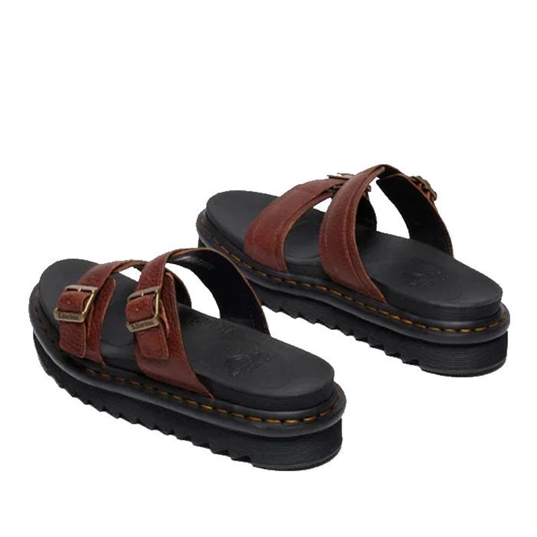 A pair of Dr Martens Myles Cashew Ambassador Brown Leather Sandals featuring two buckle straps, black cushioned footbeds, and thick black ridged EVA Zebrilus soles with visible stitching around the edges., 49260, 190665772081, 190665772098, 190665772104, 