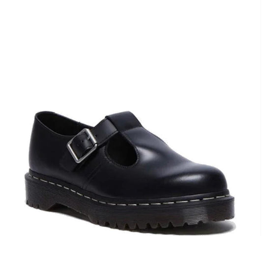 A black smooth leather Dr. Martens Polley t-bar shoe with a buckle strap and white stitching around the sole.