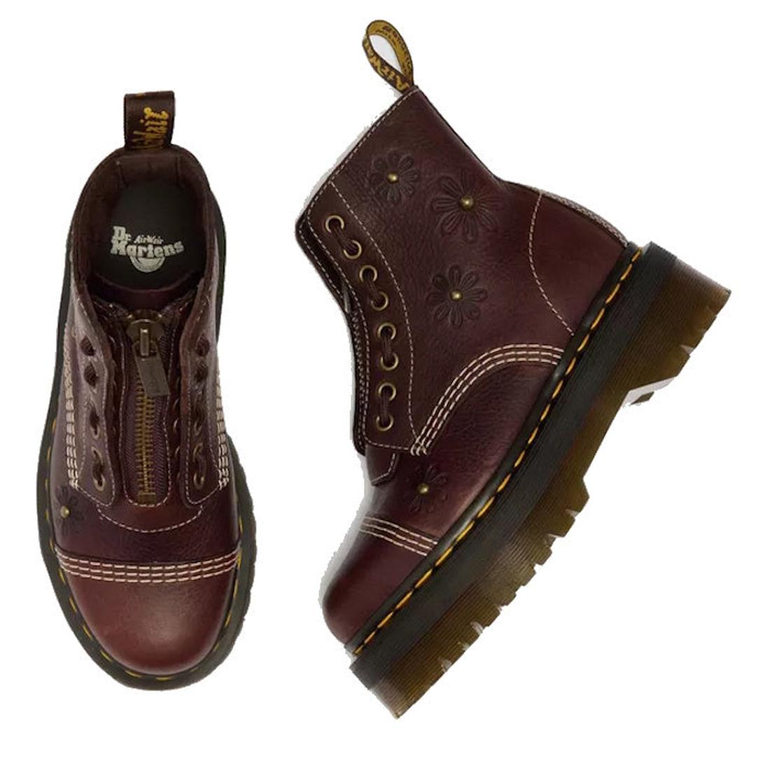 A pair of Dr Martens Sinclair Flower Dark Brown Grizzly Leather Boots featuring floral embossing, yellow stitching, thick Quad platform soles, side zippers, and branded heel loops. One boot is shown from above, the other from the side., 51903, 51904, 1906
