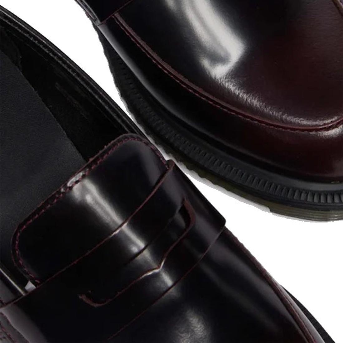 Close-up of two Dr Martens Temara Cherry Red Arcadia leather loafers with a shiny finish, classic penny strap, Goodyear-welted construction, and black rubber soles., 190665747560, 190665747577, 190665747591, 52060, 52061