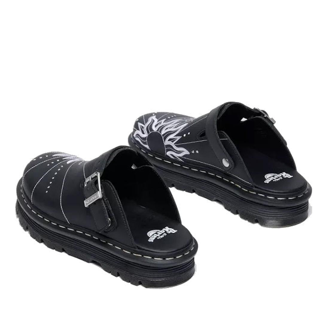 A pair of Dr Martens Zebzag Mule Solar Flare Genix Nappa Black clogs featuring a black slip-on design, ergonomic soles, white stitching, white flame details on the upper, and a silver buckle strap on one clog for extra style., 190665758818, 190665758825, 