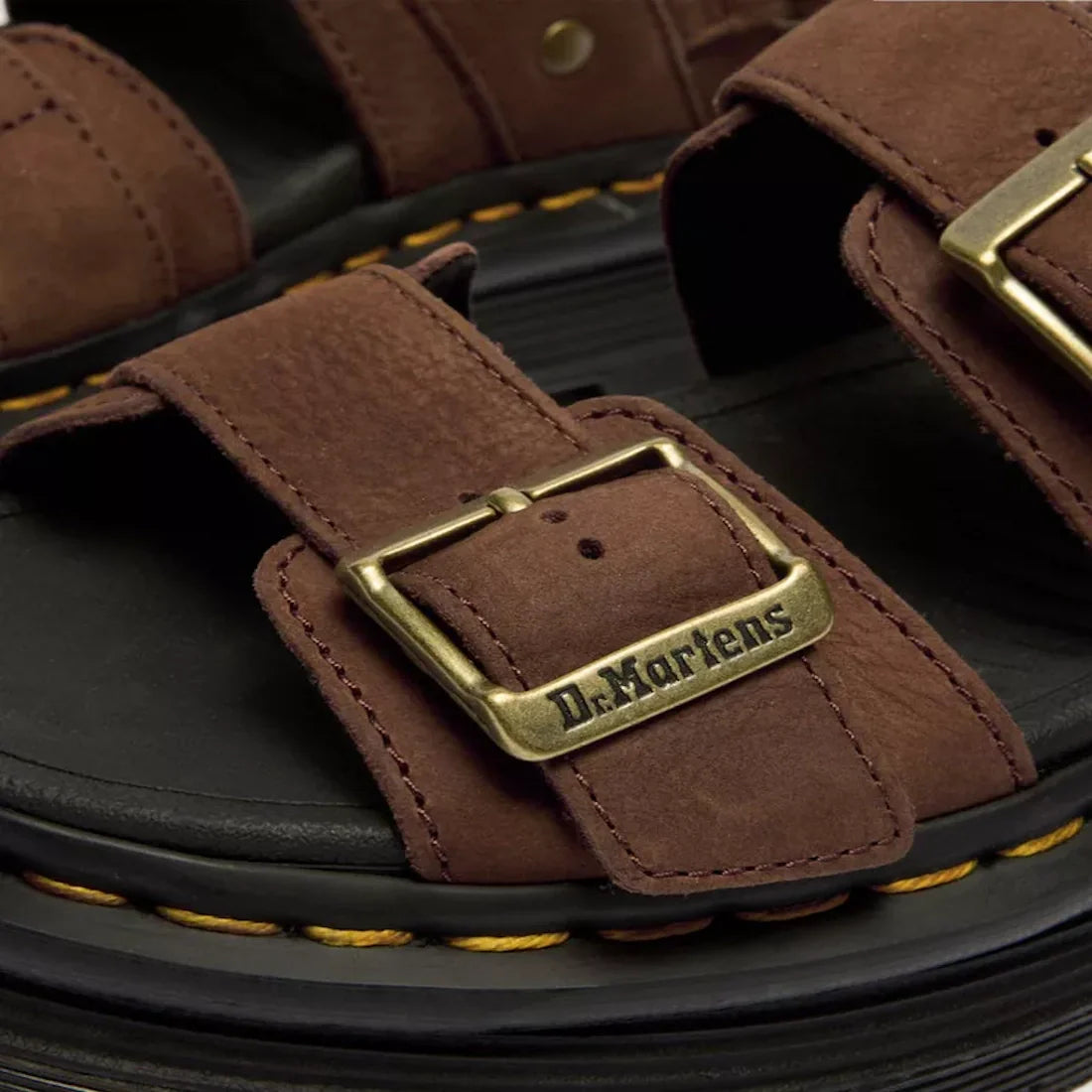 Close-up of Dr Martens Zebzag Sepia Brown Nubuck 2 Strap Sandal, featuring gold engraved buckles, black soles, and signature yellow stitching., 190665790603, 190665790610, 190665790627, 190665790641, 190665790658, 190665790665