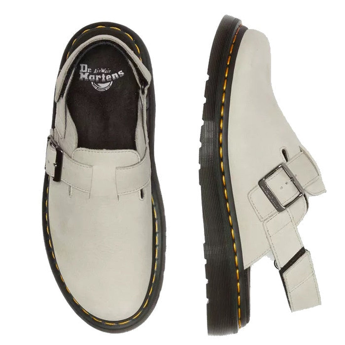 A pair of Dr. Martens Jorge II Warm Stone Buttersoft Sling Back Sandal Covered Toe shoes with white buttersoft leather, black soles, signature yellow stitching, and a side buckle strap. One shoe is top view; the other is side view.