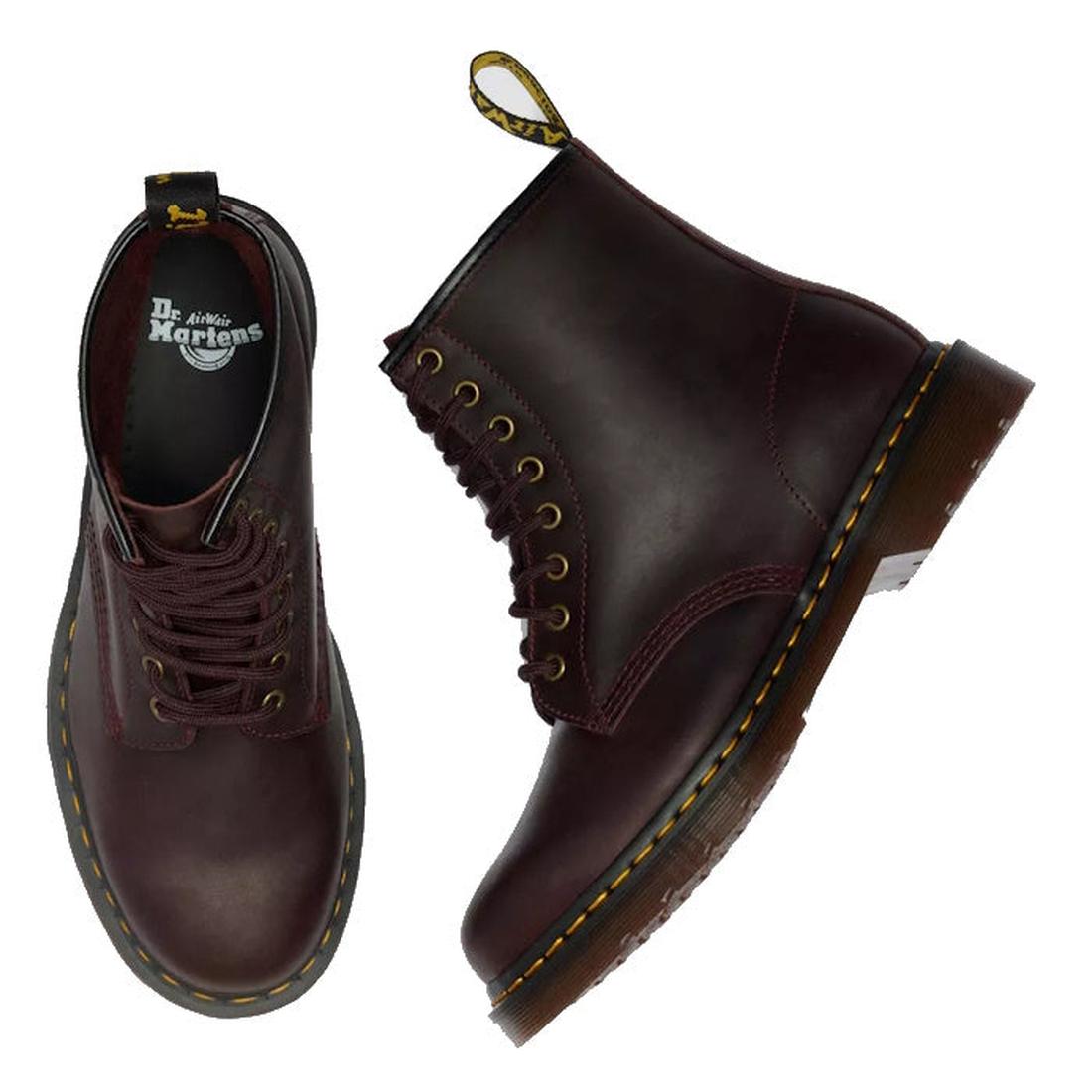 A pair of Dr Martens 1460 Cherry Red Crazy Horse Waxy Leather 8-eye boots—one upright showing the side profile and yellow stitching, the other displaying a top view with the brand logo inside., 190665786835, 190665786842, 190665786859, 190665786873, 19066
