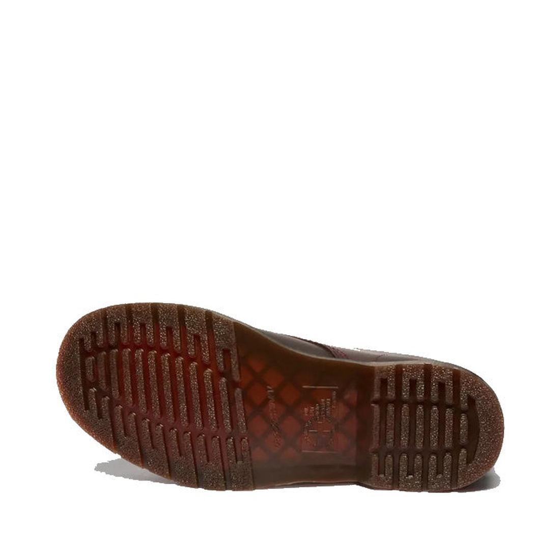 The image shows the sole of a Dr Martens 1460 Cherry Red Crazy Horse Waxy Leather 8 Eye Boot, featuring a textured, grooved tread and slightly transparent rubber material, laying on its side against a white background., 190665786835, 190665786842, 1906657