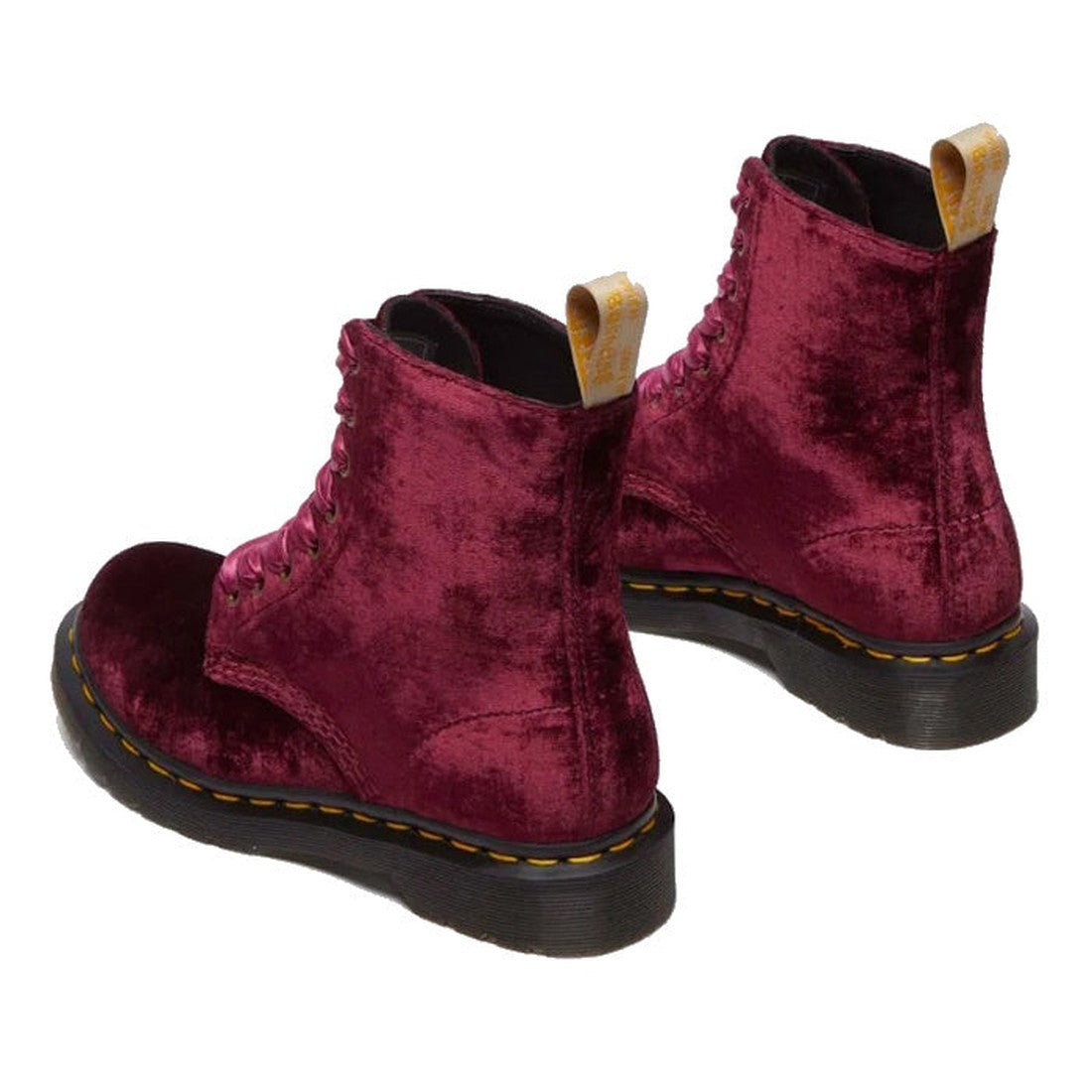 The Dr Martens 1460 Vegan Pascal Cherry Red Velvet 8 Eye Boot features a grunge-inspired, vegan velvet upper in burgundy, yellow heel pull tabs, black rubber soles with yellow stitching, shown angled to highlight the sides and backs., 42020, 190665660616,