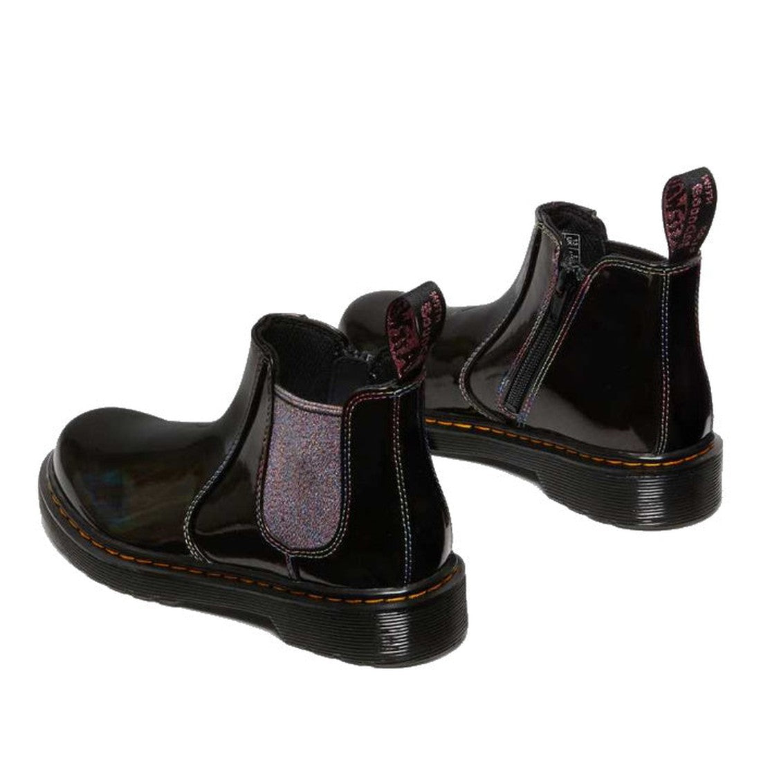 A pair of Dr Martens Kids Juniors 2976 J Chelsea Boot Black Lightshow Sparkle Rays, styled with shiny black finish, elastic side panels, pull tabs, visible stitching on thick soles, and a side zipper shown on the right boot., 190665495171, 190665495195, 1