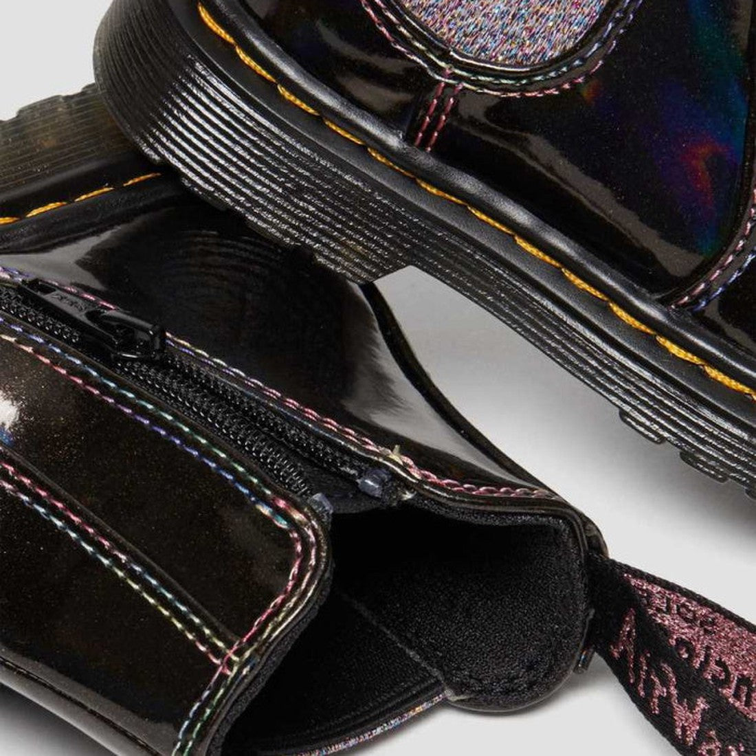 Close-up of Dr Martens Kids Toddlers 2976 T Chelsea Boot in Black Lightshow Sparkle Rays with iridescent detailing, side zipper, pull tab, and signature yellow stitching. LAST ONE available in toddlers UK8., 190665494914, 190665494921