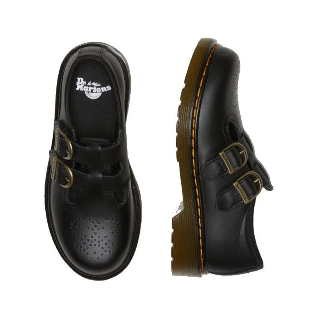 A pair of Dr. Martens Kids 8065 J Black Softy T Mary Jane leather shoes with double buckle straps, toe perforations, and chunky brown air-cushioned soles with yellow stitching; one shoe is shown from the top, the other from the side., 41982, 41983, 190665