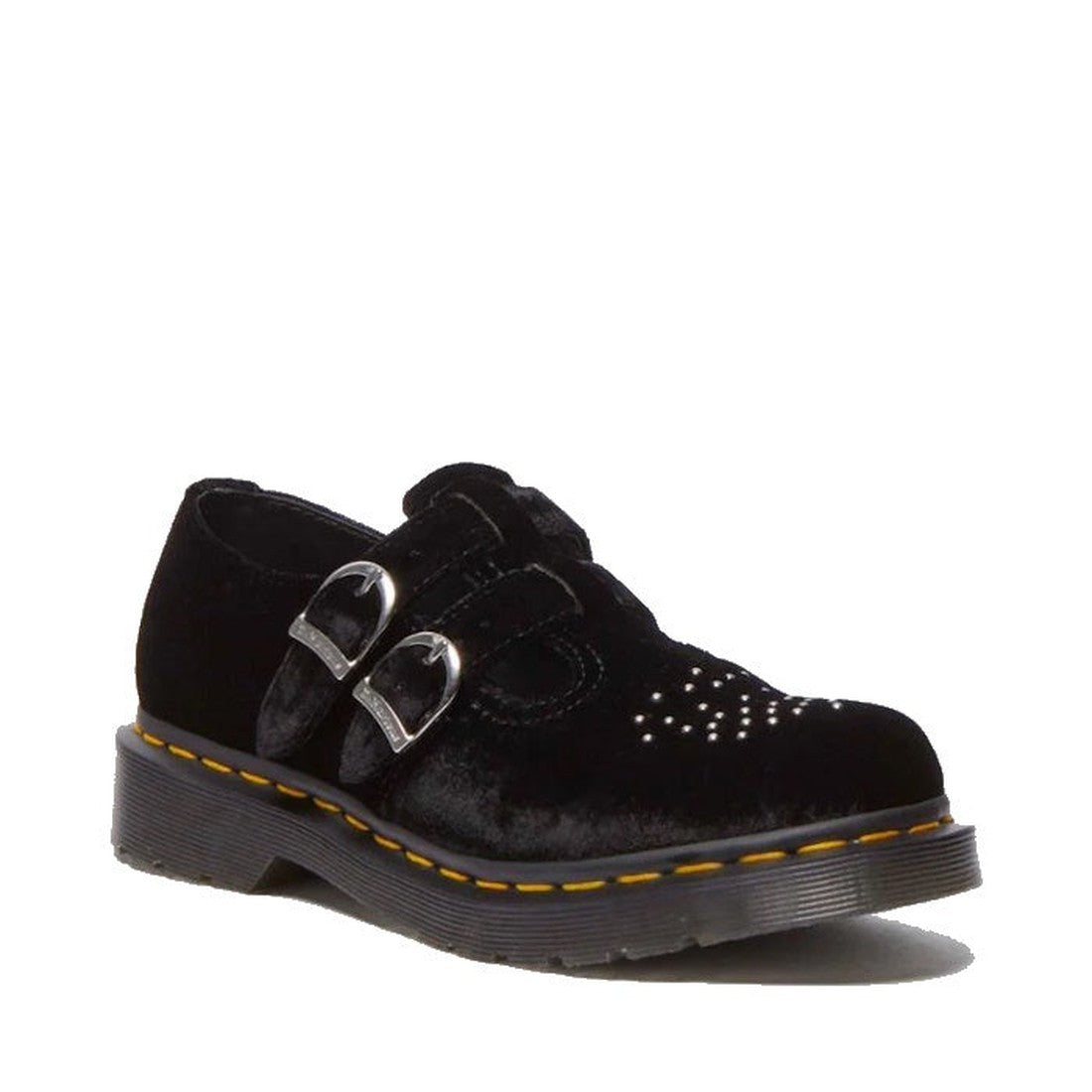 The Dr Martens 8065 2 Strap Mary Jane Vegan Black Velvet shoe features two silver buckles, brogue studs on a perforated toe, and a thick rubber sole with yellow stitching.