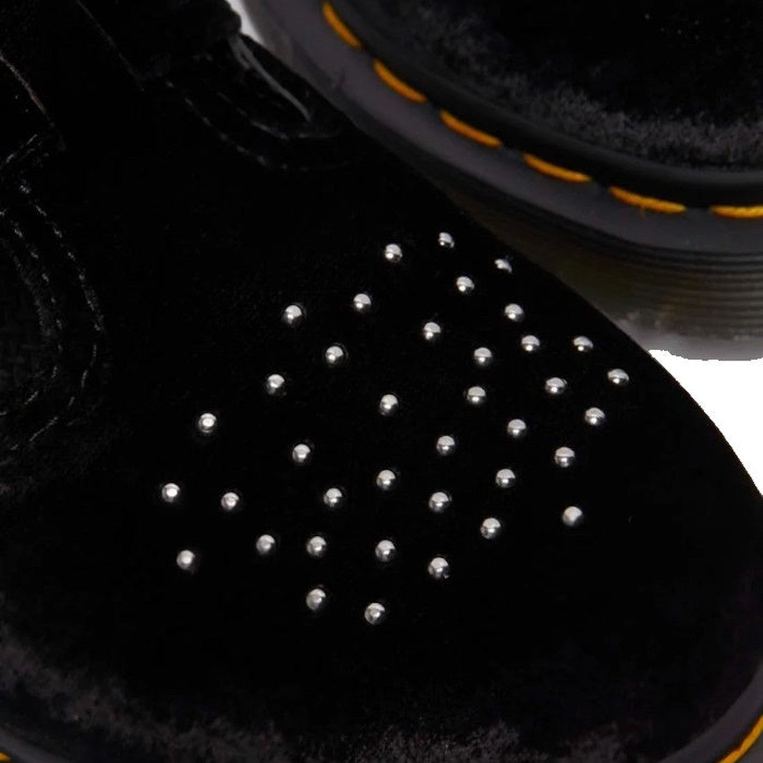 Close-up of the Dr Martens 8065 2 Strap Mary Jane Vegan Black Velvet shoe featuring black velvet material, grid-patterned brogue studs on the toe, and yellow stitching around the sole., 190665660456, 190665660463, 190665660470, 190665660494, 190665660500,