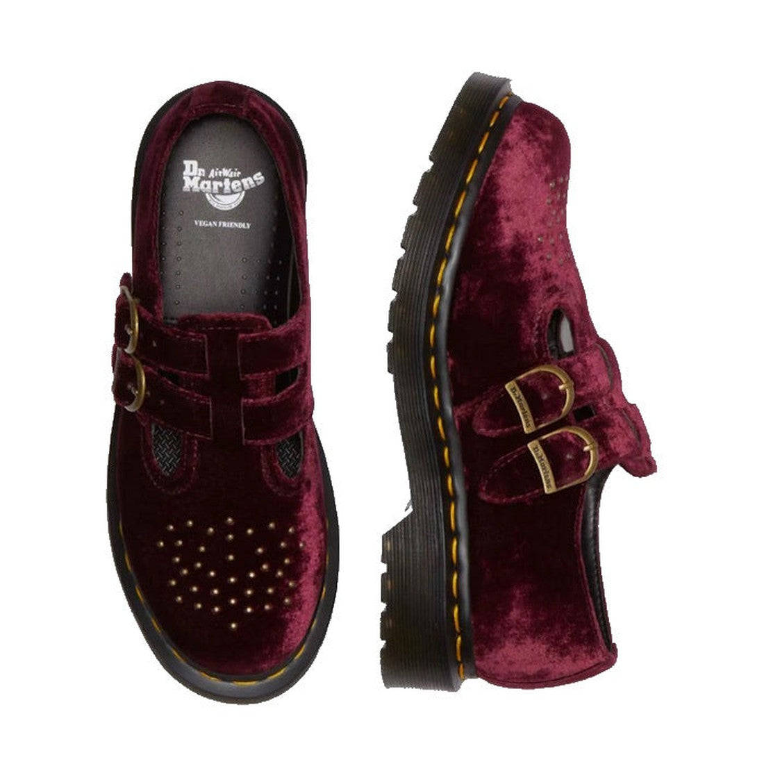 A pair of Dr. Martens 8065 2 Strap Mary Jane Vegan Cherry Red Velvet shoes with two gold buckles each, yellow stitching, and perforated toe detail. One Goodyear-welted shoe is shown from above, the other from the side., 42014, 190665660548, 190665660555, 