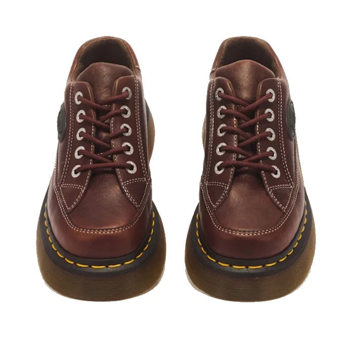 Dr Martens Buzz 5i Dark Brown Grizzly Leather Shoes photographed from above against a white background, featuring brown Grizzly leather, white stitching, chunky barrel-edge Buzz soles with thick brown profiles, and yellow stitching around the edge—a style
