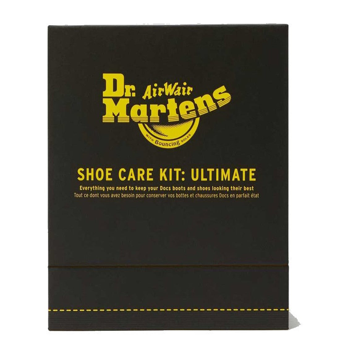 The Dr Martens Shoe Care Kit Ultimate Box is a black shoe shine box with yellow text showing the logo and "Shoe Care Kit: Ultimate," featuring Wonder Balsam and care tips for boots and shoes in English and French., 190665251326