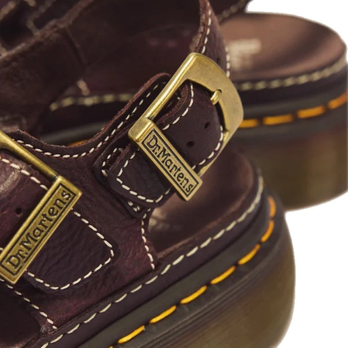 Dr Martens Wrenlie Flower Open Toe Dark Brown Grizzly Quad Sandal featuring dark brown Grizzly leather, an open-toe design, brass buckles, white contrast stitching, and yellow welt stitching on a Quad Shore sole.