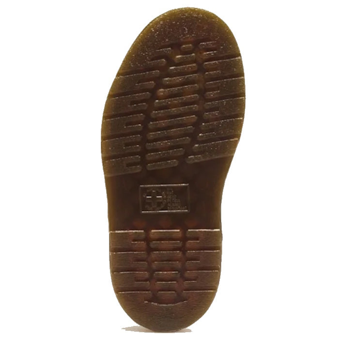 The textured, translucent brown Quad Shore sole of a Dr Martens Wrenlie Flower Open Toe Dark Brown Grizzly Quad Sandal, viewed from underneath.