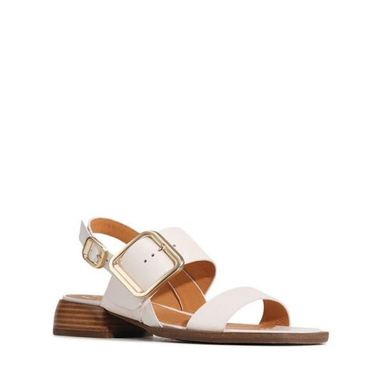 The EOS Ikam Womens Bone Leather Low Heeled Sandal w/Back Strap features a wide front strap, large gold buckle on the ankle strap, and a low wooden heel, shown against a plain white background.