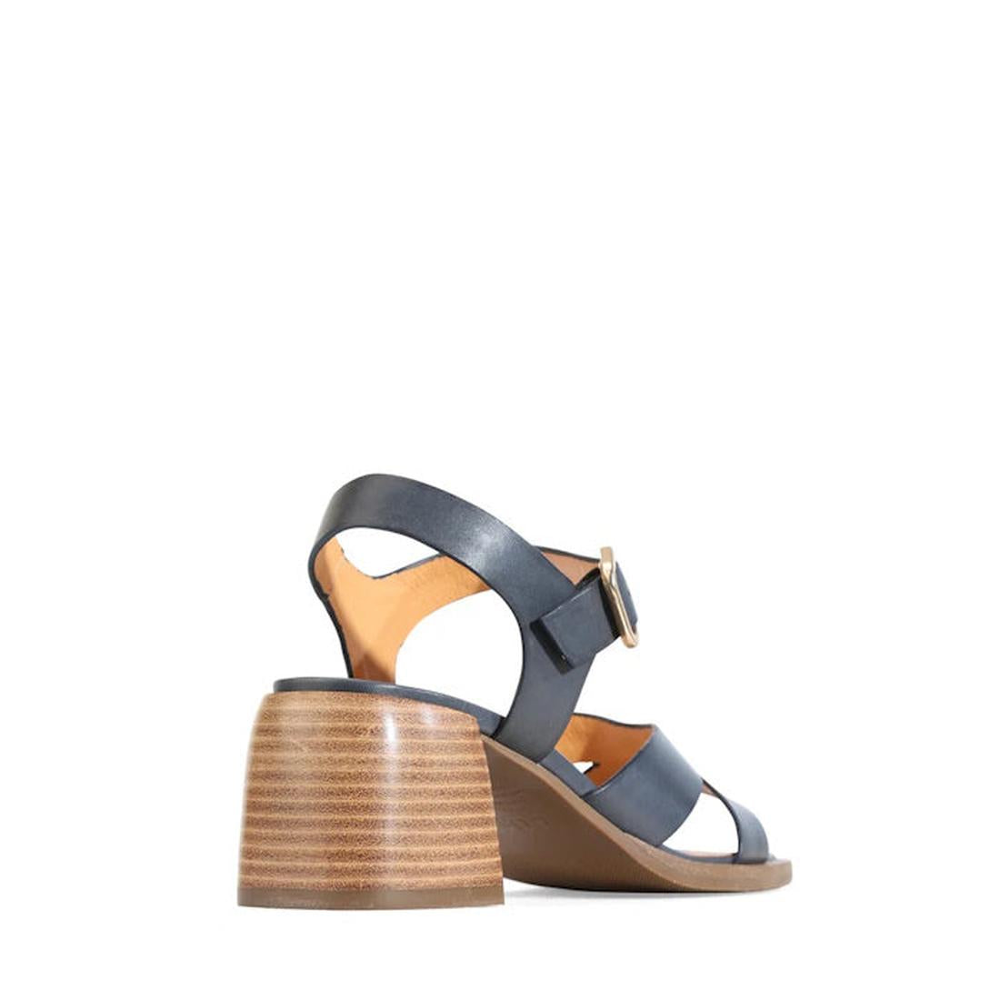 The EOS Isoken Navy Leather Heeled Women's Sandal features strappy navy leather, a medium stacked wooden heel, and a gold buckle, shown on a white background from the back left side., 9321191307084, 9321191307091, 9321191307107, 9321191307114, 93211913071