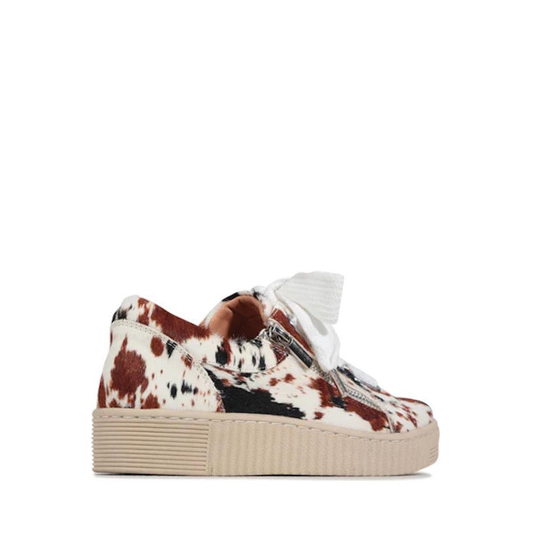 Side and heel view of the EOS Jovi Texas Pony Leather Lace Up With Zip—a low-top sneaker with cowhide pattern in brown, black, and white, thick beige sole, side zip, and white laces., 51482, 9321190036015, 9321190036022, 9321190036039, 9321190036046, 9321
