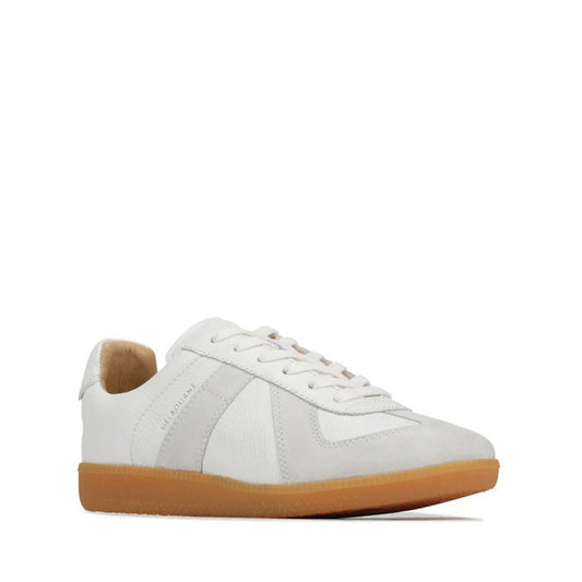 The EOS Melbaa White Leather Lace Up Trainer features white aniline leather, light gray suede accents, white laces, and a tan gum sole—offering a stylish update on the classic casual t-toe sneaker.