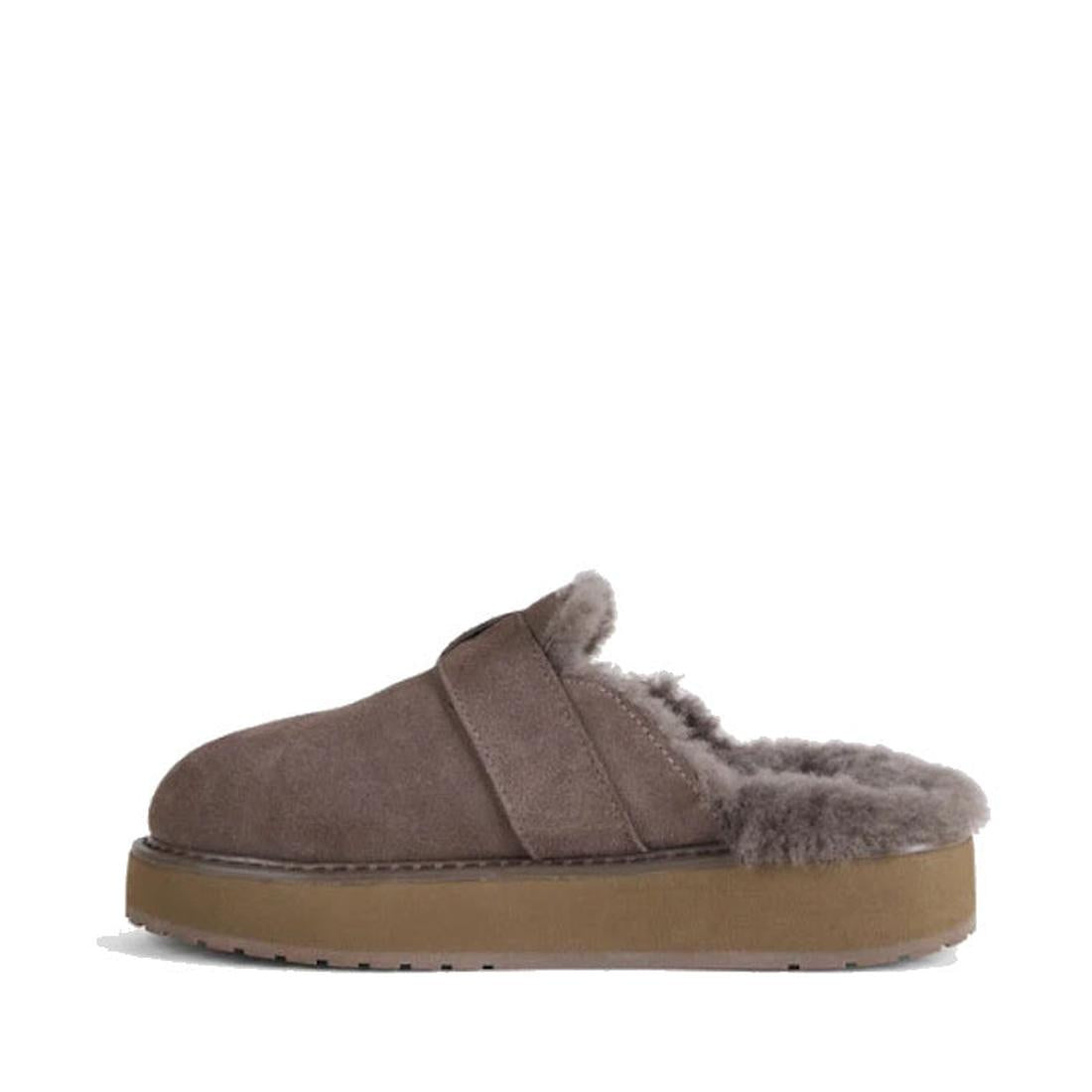 A single Emu Womens Adison Smoke Grey Wool Mule Slipper Scuff with a fluffy gray sheepskin lining and a thick tan rubber sole, viewed from the side against a white background., 50716, 9330071986417, 9330071986424, 9330071986431, 50720, 50721