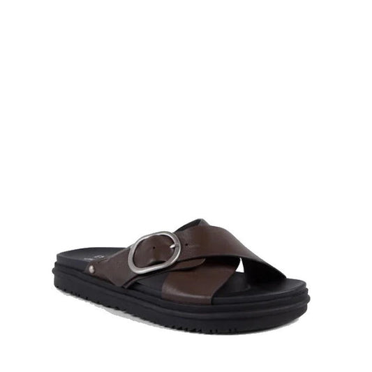 The Emu Ebony Espresso Black Leather Slide Sandal features cross-over brown leather straps, an adjustable buckle, and a black cushioned sole on a white background for enhanced comfort.