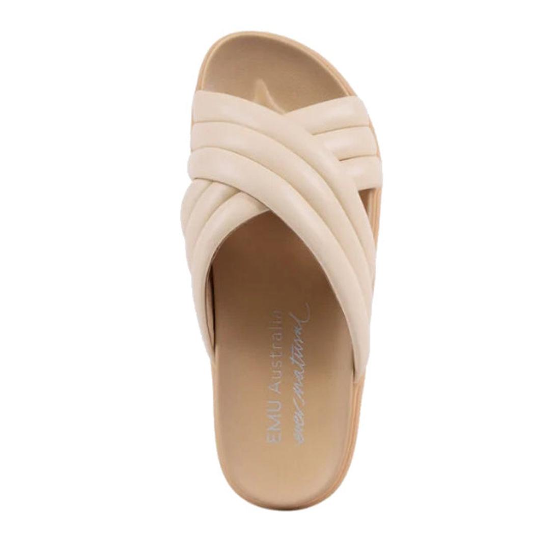 The Emu Ella Macadamia Tan Off White Leather Women's Summer Slide features thick, crisscrossed beige straps and an open toe. Soft leather uppers complement the comfy footbed, with "EMU Australia" and "ever natural" in white on the insole., 9330071982990, 