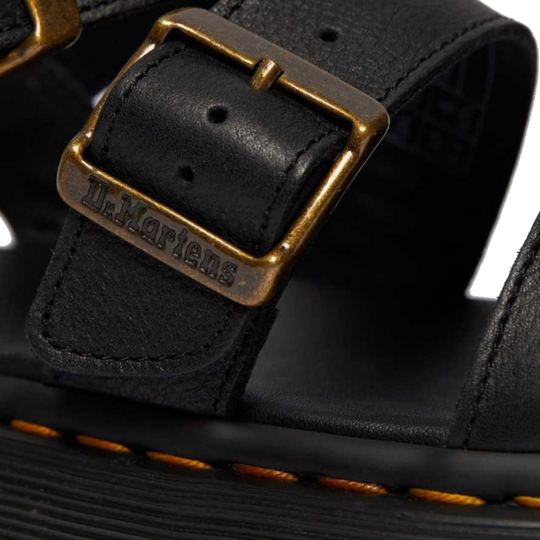 A close up shot of the detailing on the buckle of a Dr Martens Gryphon Quad showing the Dr Martens branding.,
190665318654,
190665318661,
190665318678,
190665318685,
190665318692,
190665318708,
190665318715,, 190665318654, 190665318661, 190665318678, 1906