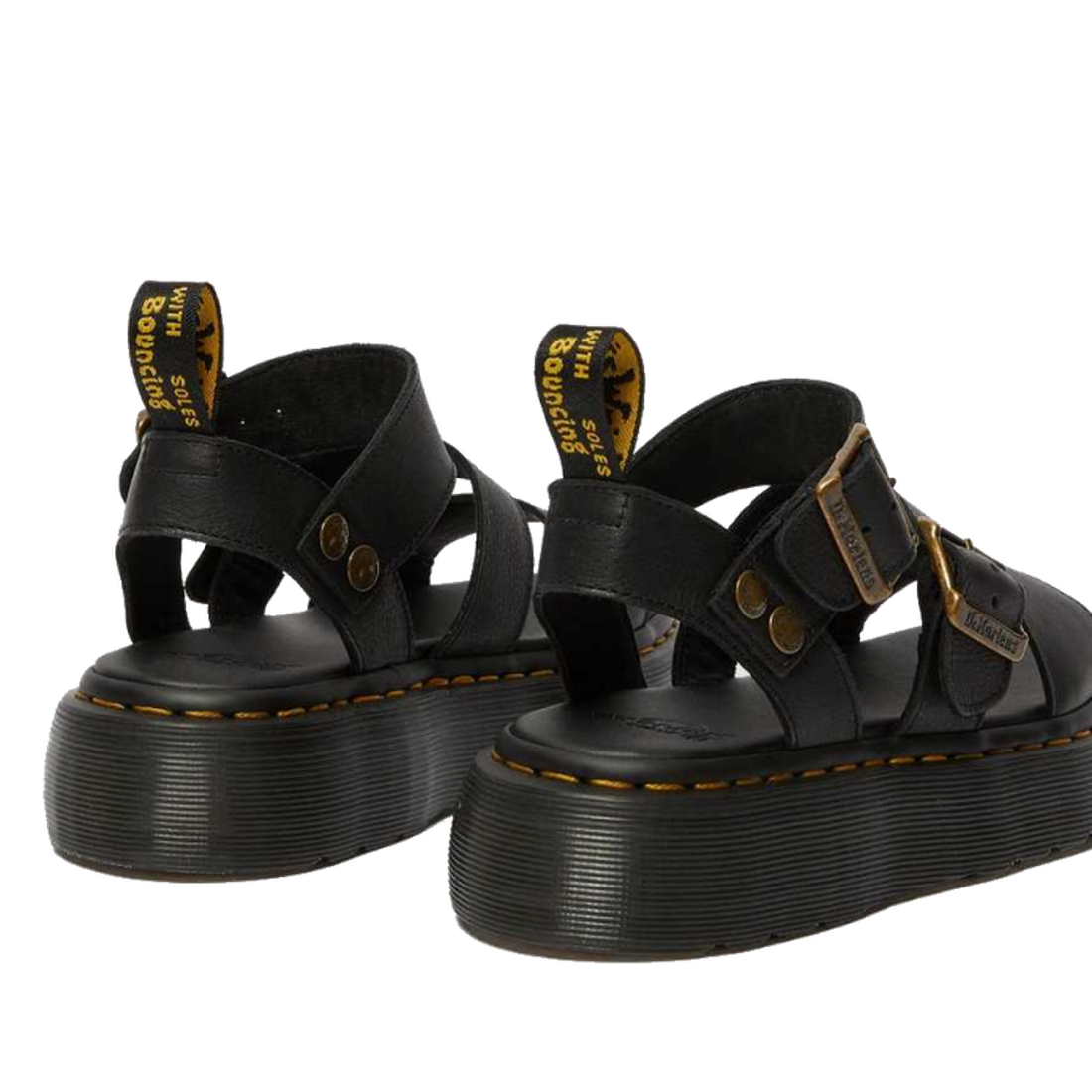 A rear shot of a pair of Dr Martens Gyrphon Sandals in Black shing teh dr martens branded pull tabs, yellow stitching around the sole and slightly platformed sole.,
190665318654,
190665318661,
190665318678,
190665318685,
190665318692,
190665318708,
190665