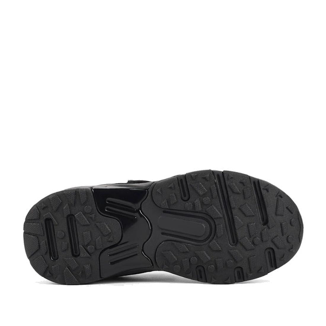 The image displays the black rubber sole of the Harrison Nifty Black School Trainer, featuring a textured tread pattern with varied shapes for improved grip and traction, combining rugged design with both smooth and raised areas., 48569, 48570, 48571, 936