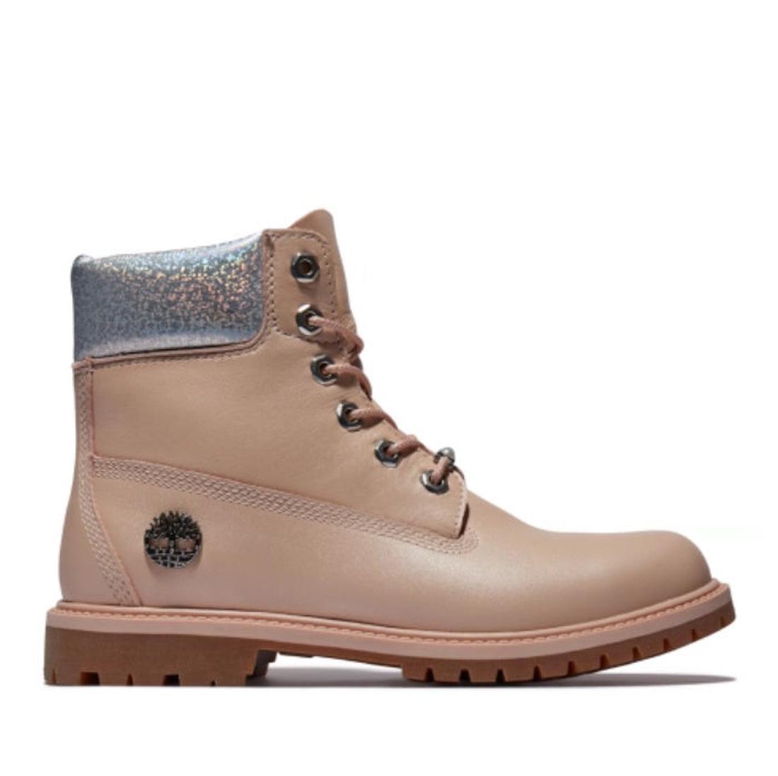 The Timberland Heritage 6 Inch Boot offers waterproof comfort in light pink nubuck, with a sturdy brown sole and easy lace-up front.  ksnz