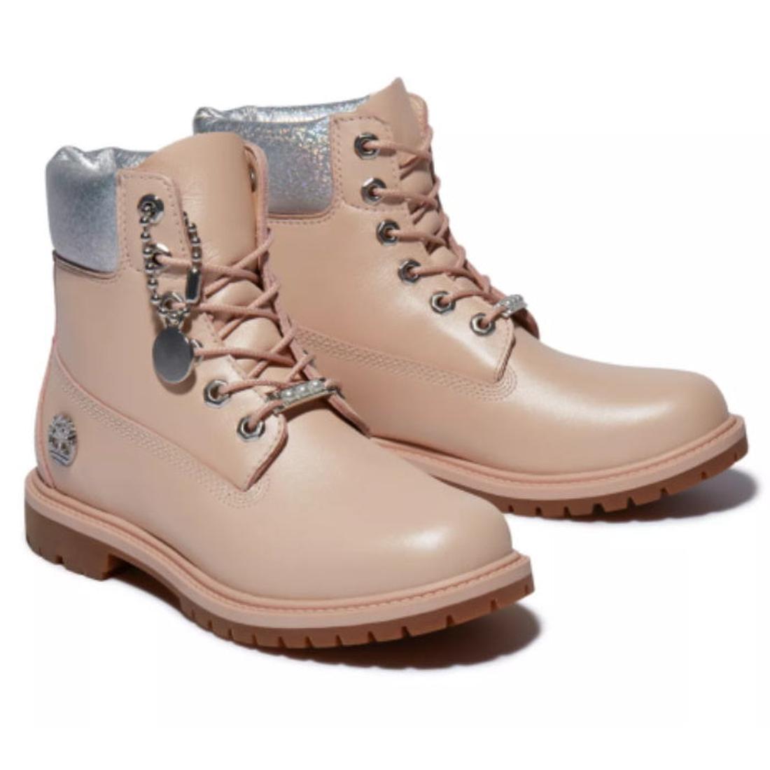 Timberland Heritage 6 Inch Waterproof Boot in light pink nubuck for kids; sturdy sole, sparkly laces, and comfy padded collar.  ksnz